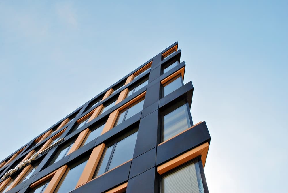 Modern building with geometric glass facade.